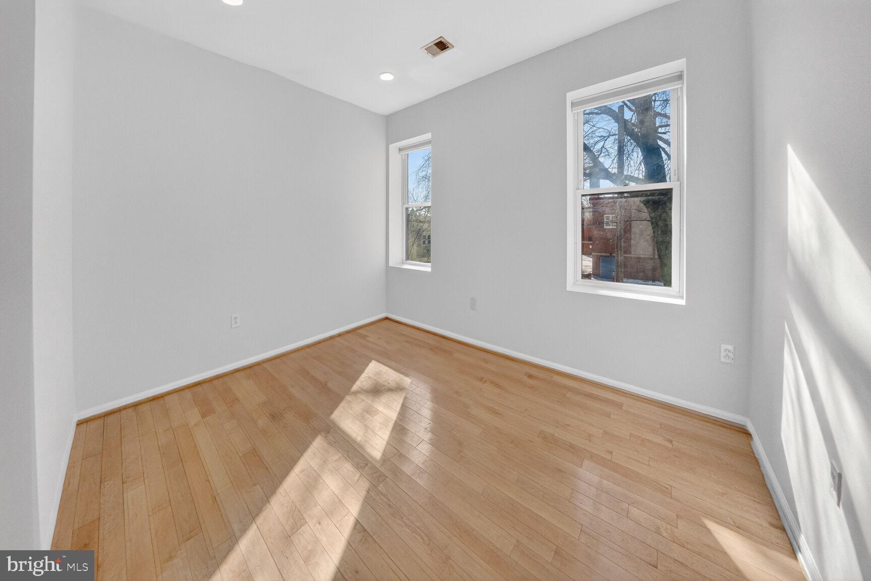 424 Q Street Northwest, Unit H Washington, DC 20001 - Photo 3 of 16 a view of empty room with window