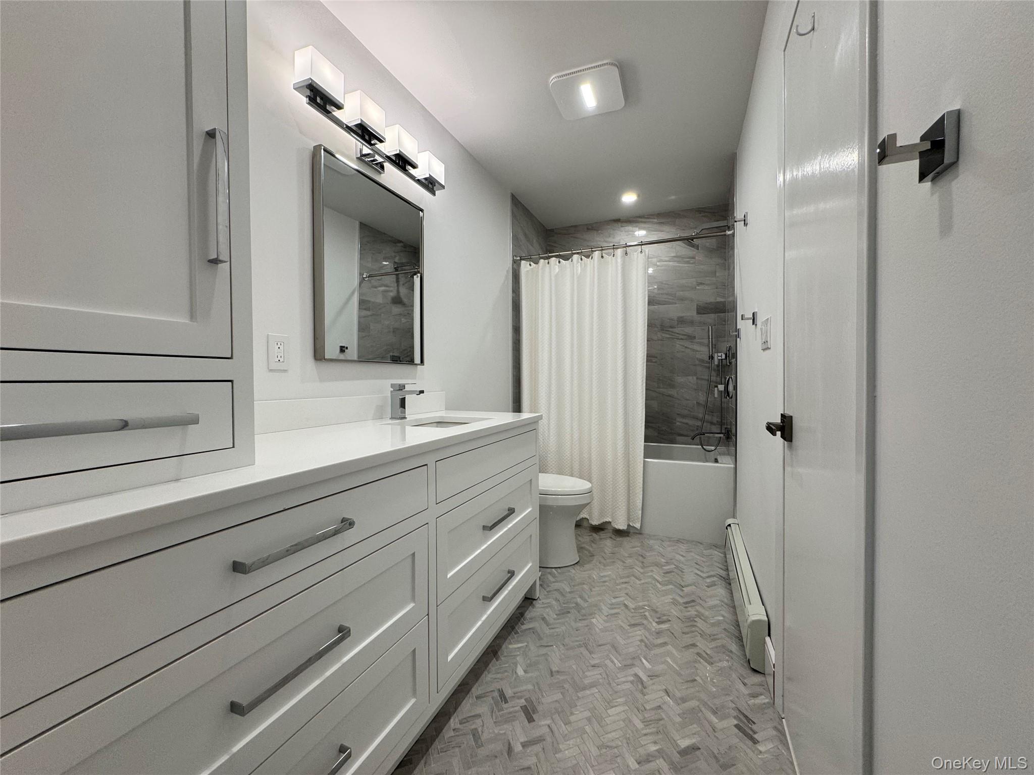 1 Deer Path Quogue, NY 11959 - Photo 25 of 38 a bathroom with a double vanity sink toilet mirror and shower