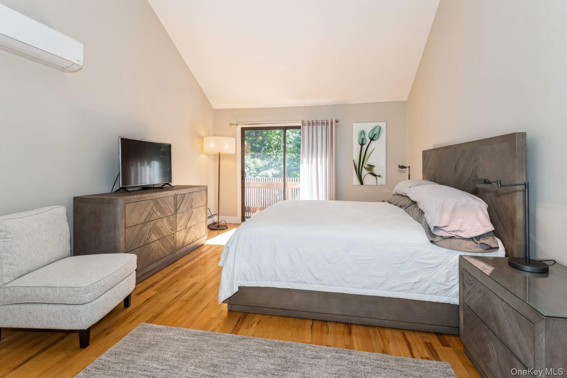 1 Deer Path Quogue, NY 11959 - Photo 26 of 38 a bedroom with a bed and window