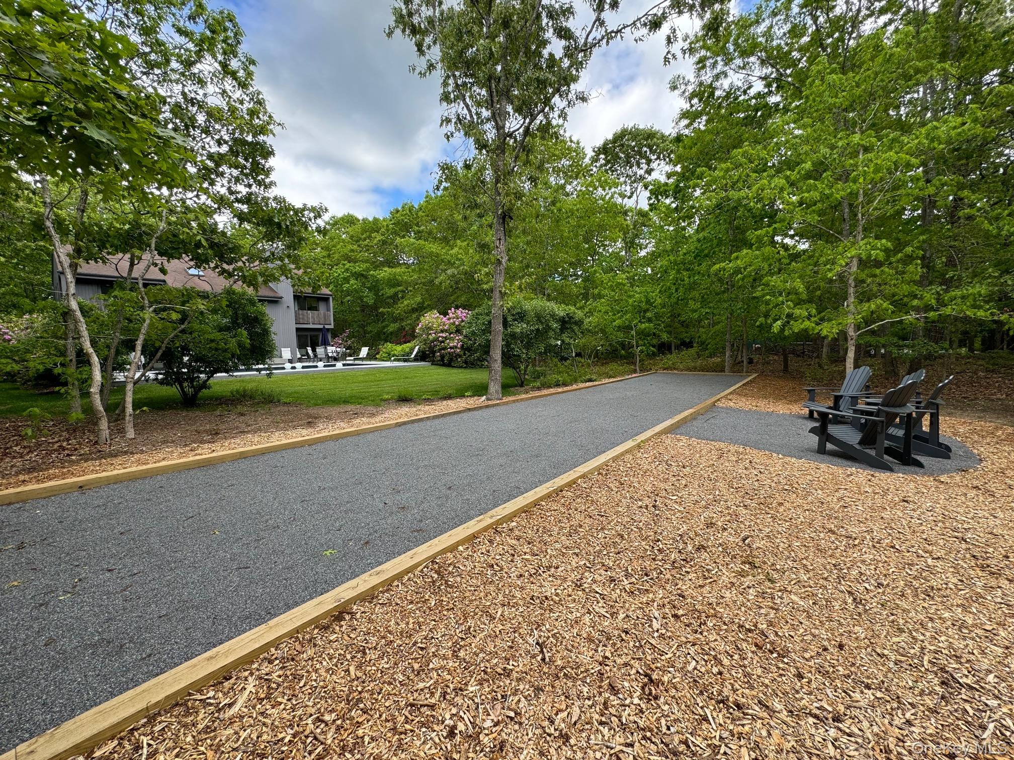 1 Deer Path Quogue, NY 11959 - Photo 28 of 38 View of road featuring view of wooded area