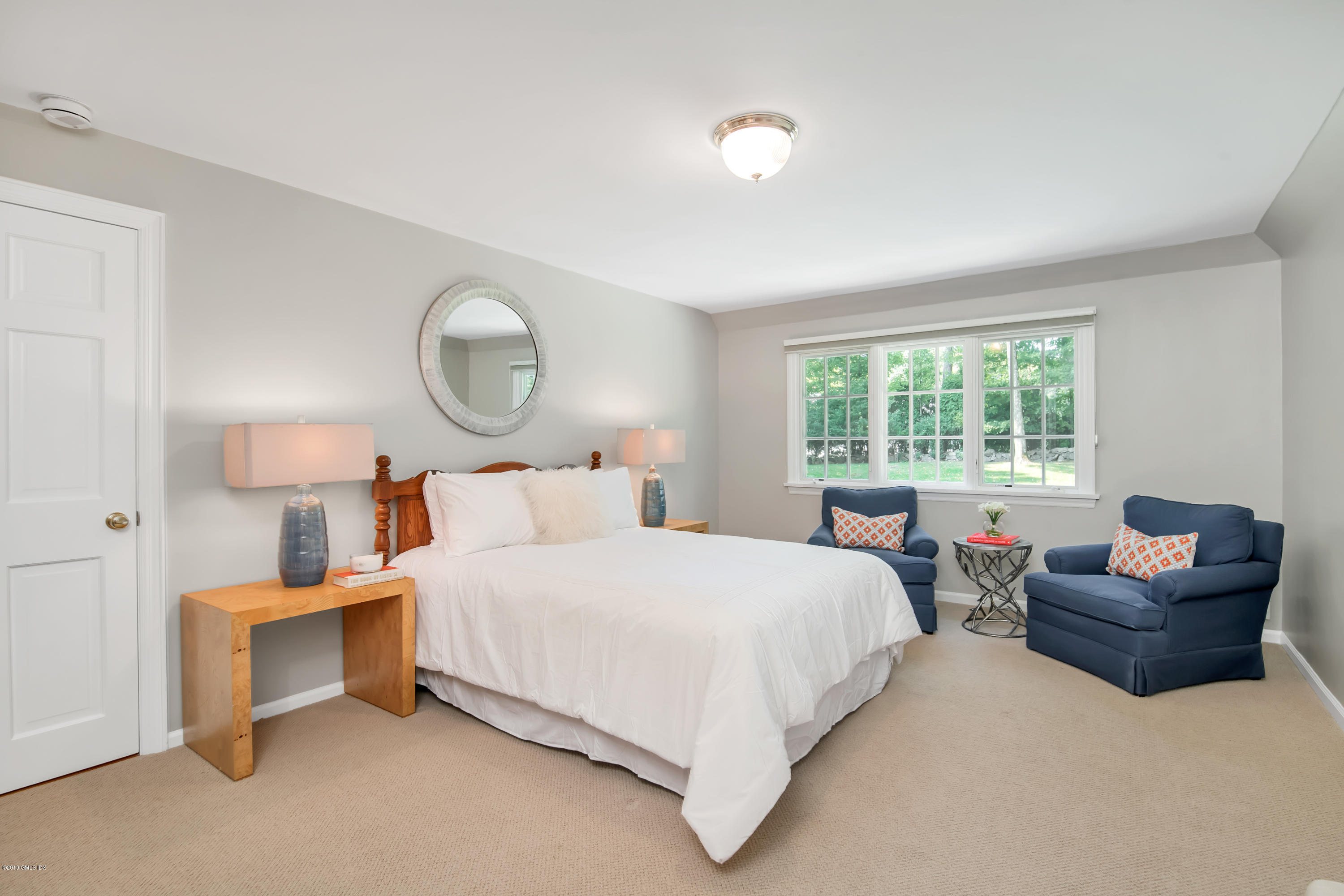 95 Perkins Road Greenwich, CT 06830 - Photo 14 of 30 a bedroom with a bed and a large window