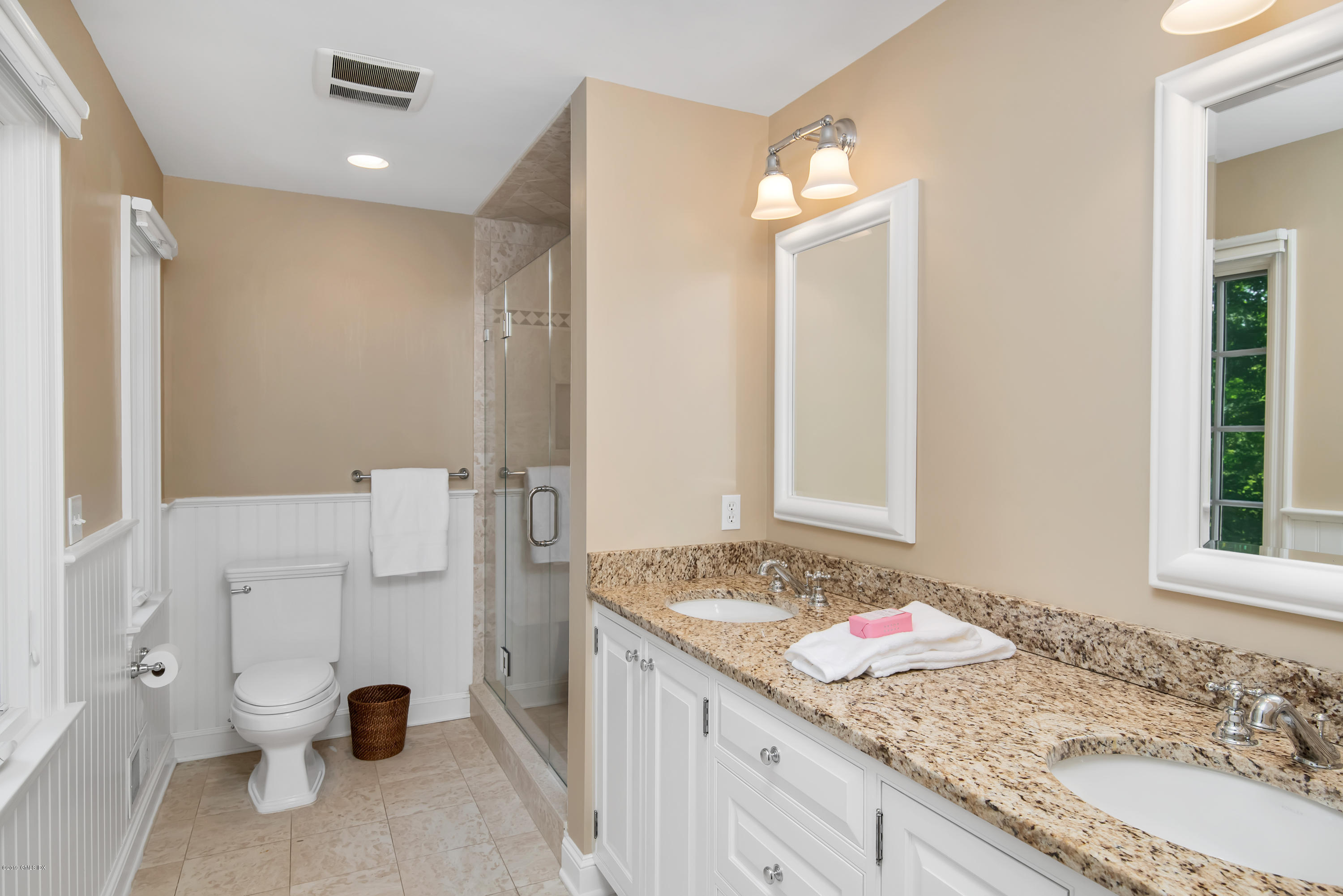 95 Perkins Road Greenwich, CT 06830 - Photo 15 of 30 a bathroom with a granite countertop sink and a mirror