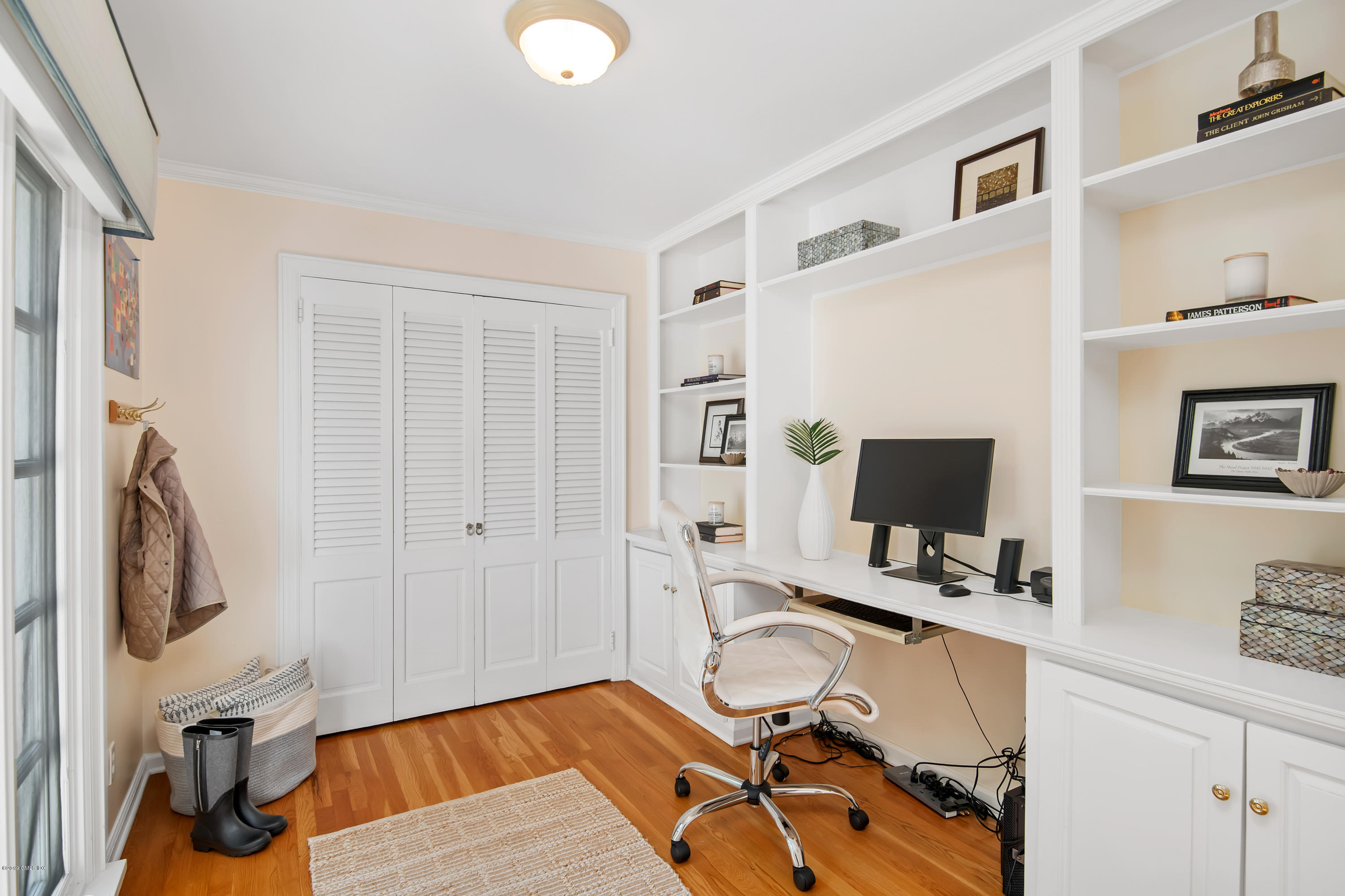 95 Perkins Road Greenwich, CT 06830 - Photo 20 of 30 a view of a workspace with furniture and a flat screen tv
