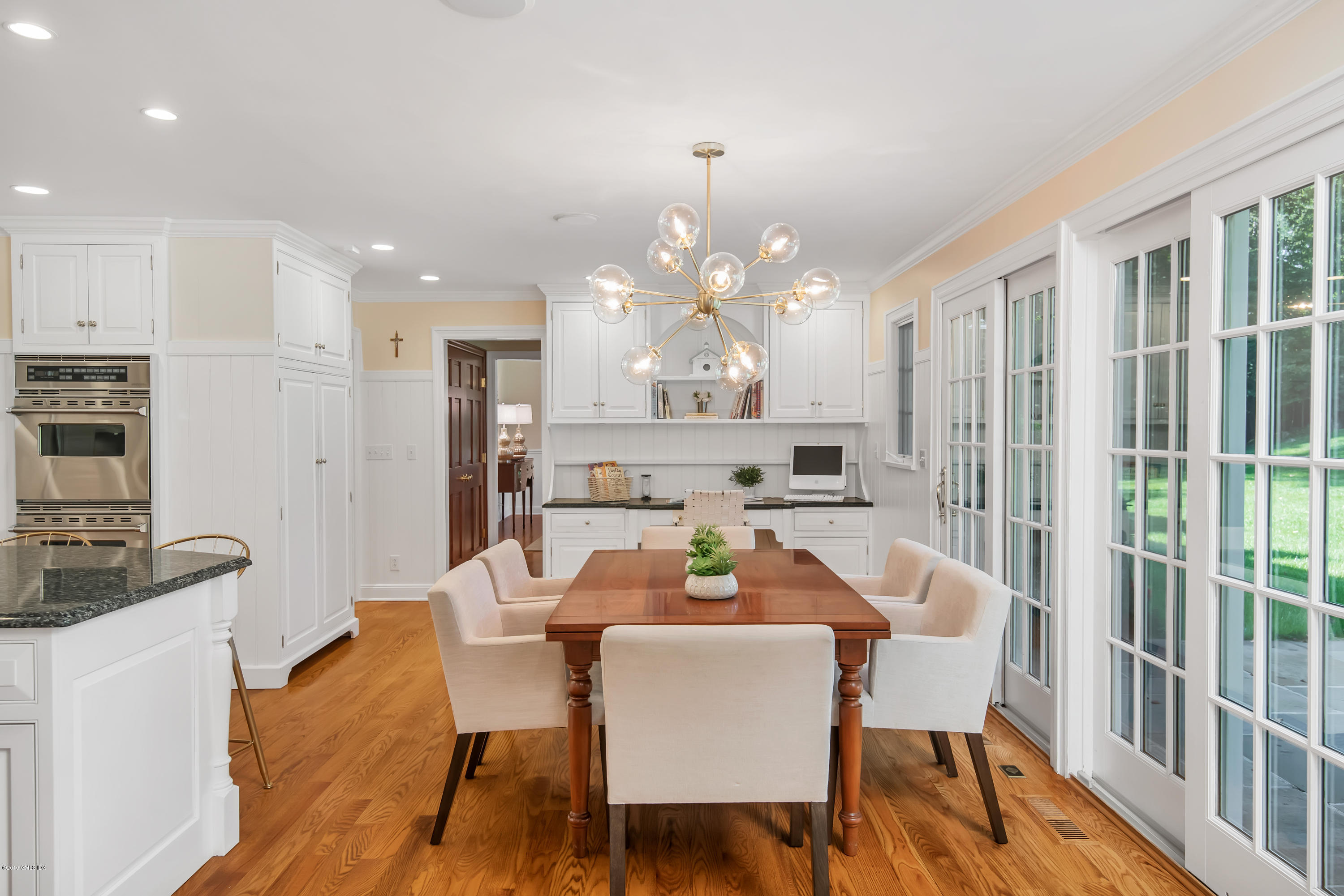 95 Perkins Road Greenwich, CT 06830 - Photo 9 of 30 a view of a dining room with furniture window and wooden floor