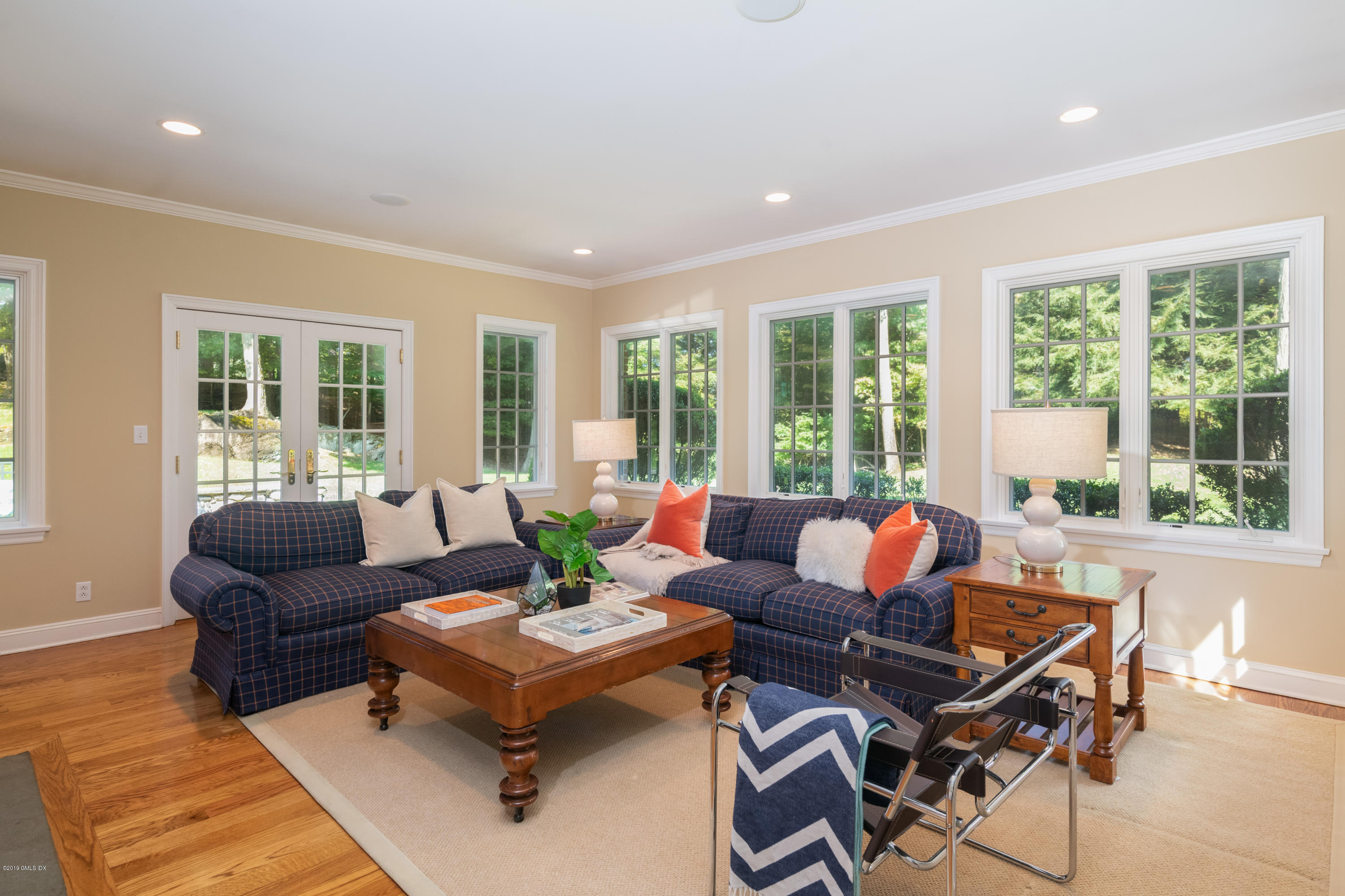 95 Perkins Road Greenwich, CT 06830 - Photo 10 of 30 a living room with furniture and large windows