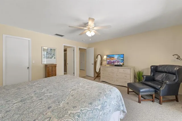 a bedroom with a bed and a couch