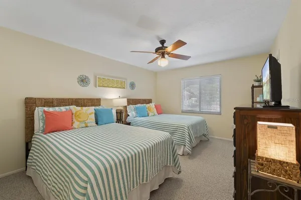 a bedroom with double bed and a window