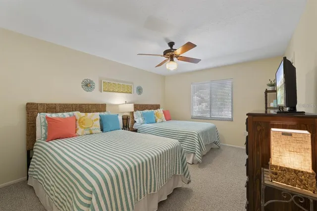 a bedroom with double bed and a window