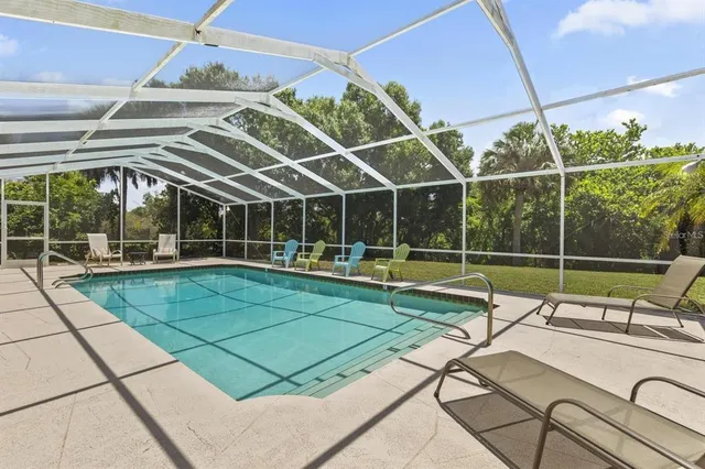 a view of a swimming pool with a patio