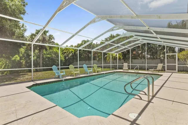 a view of a swimming pool with a porch