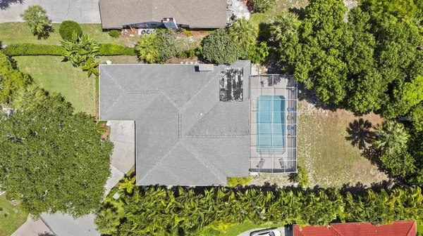 an aerial view of a residential apartment building with a yard