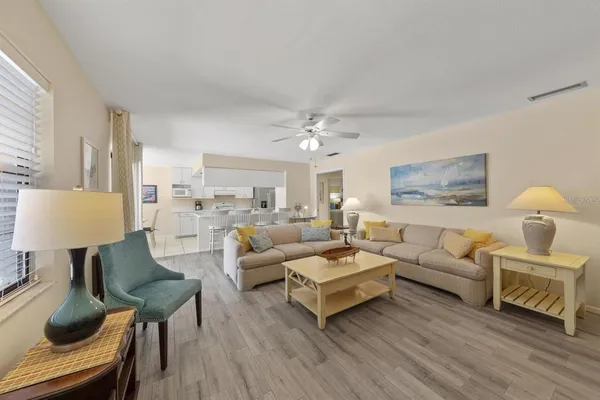 a living room with furniture and a lamp