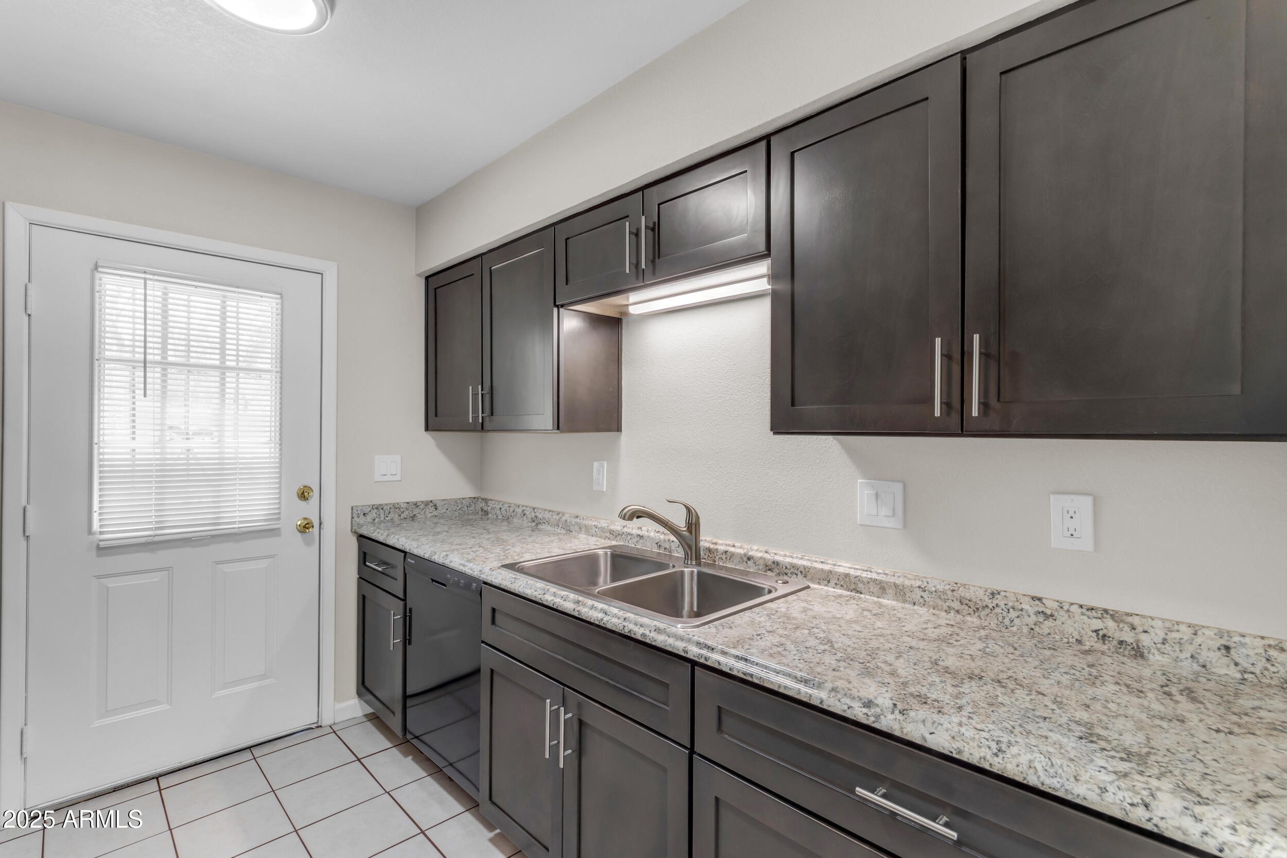 834 North Cherry, Unit 102 Mesa, AZ 85201 - Photo 13 of 24 a kitchen with a sink and cabinets