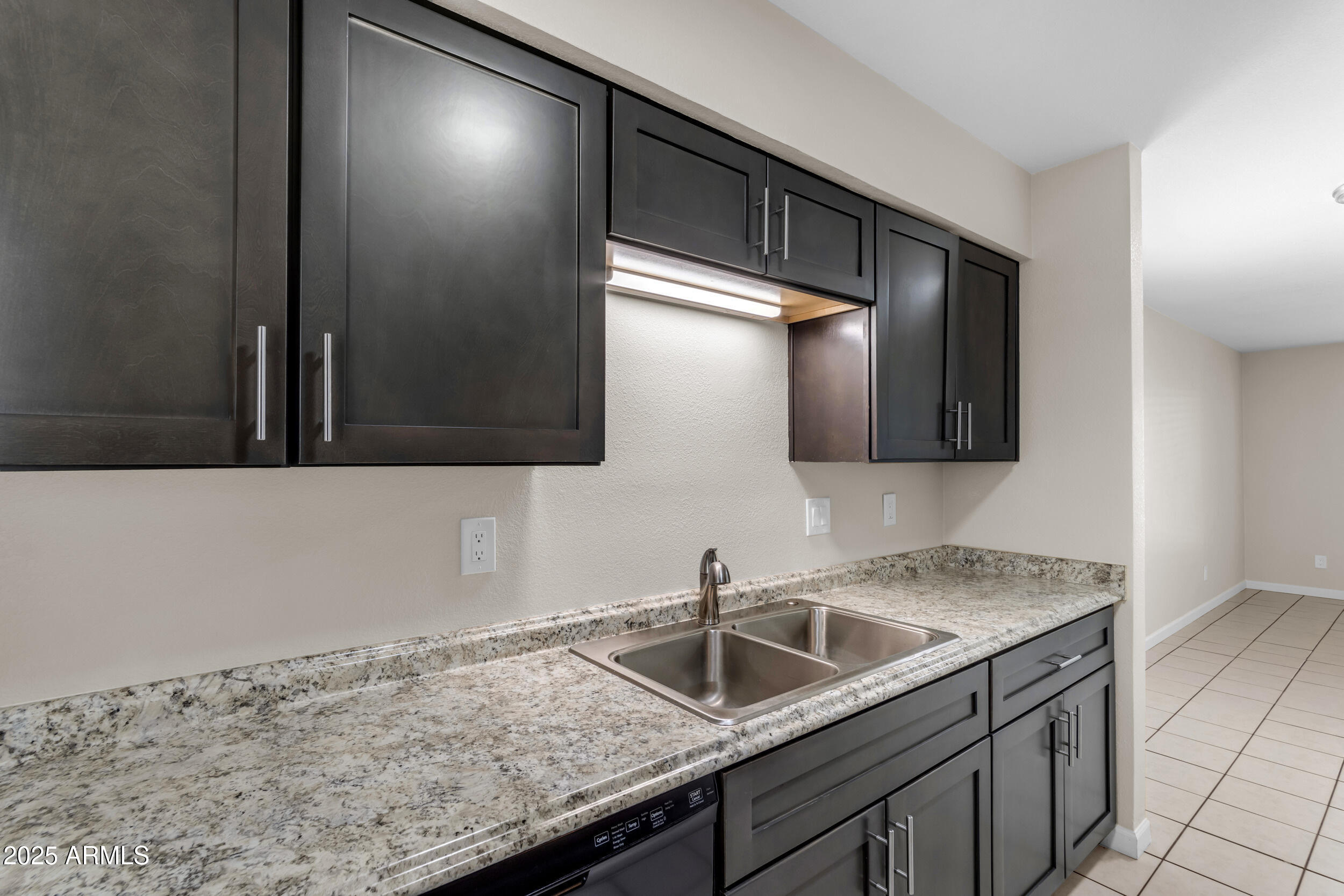 834 North Cherry, Unit 102 Mesa, AZ 85201 - Photo 14 of 24 a kitchen with a sink and cabinets