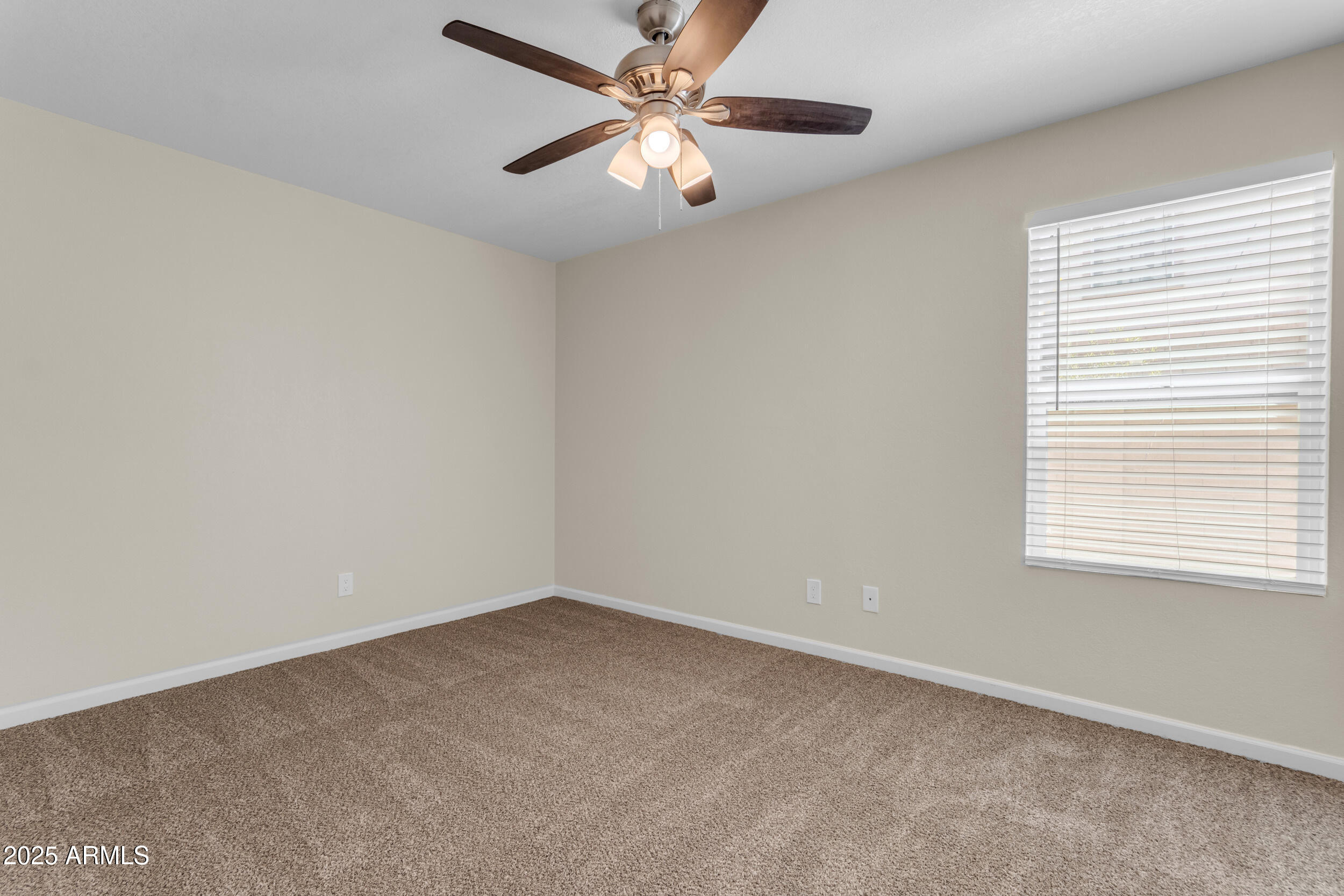 834 North Cherry, Unit 102 Mesa, AZ 85201 - Photo 22 of 24 an empty room with a window and a fan