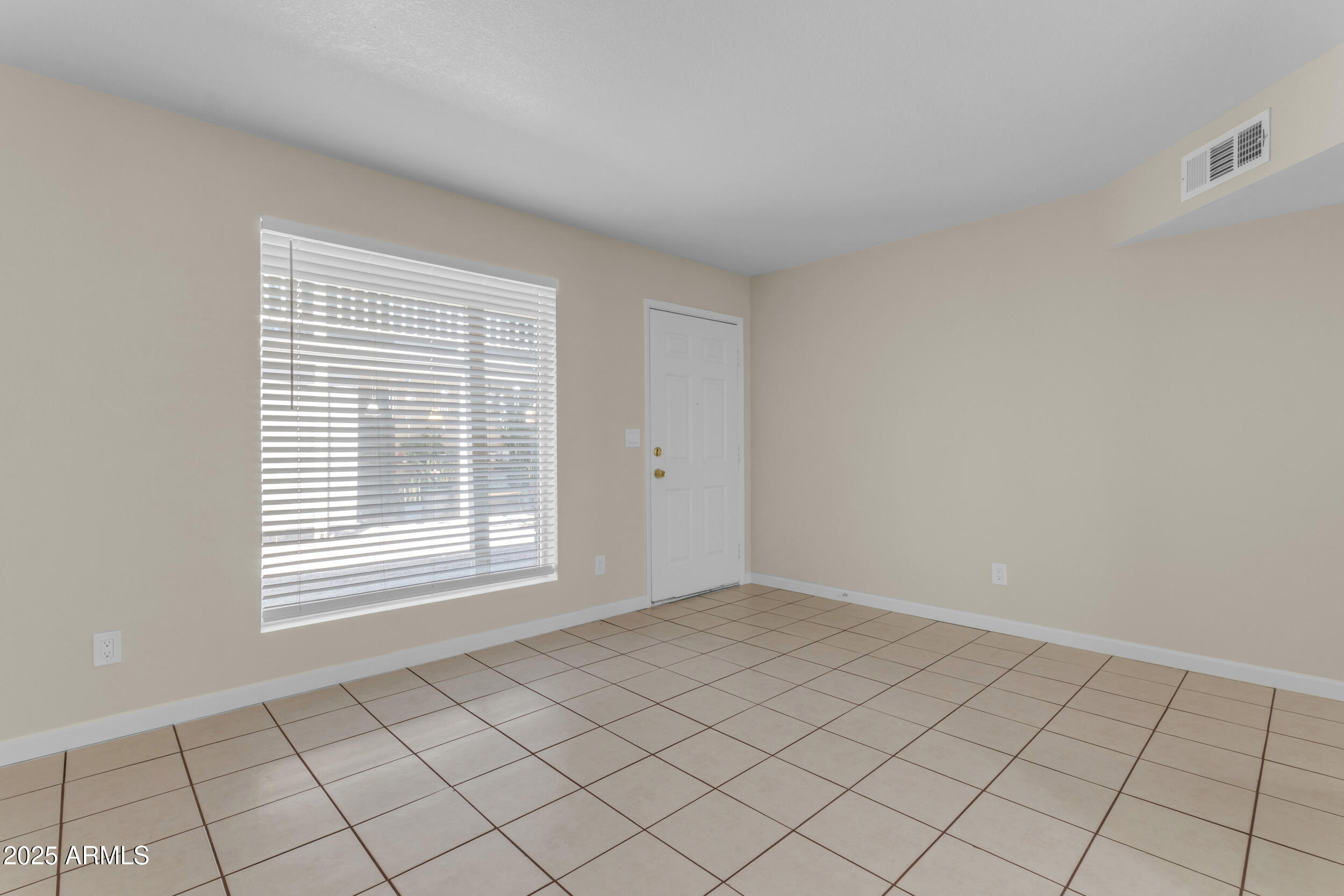 834 North Cherry, Unit 102 Mesa, AZ 85201 - Photo 6 of 24 a view of an empty room with window