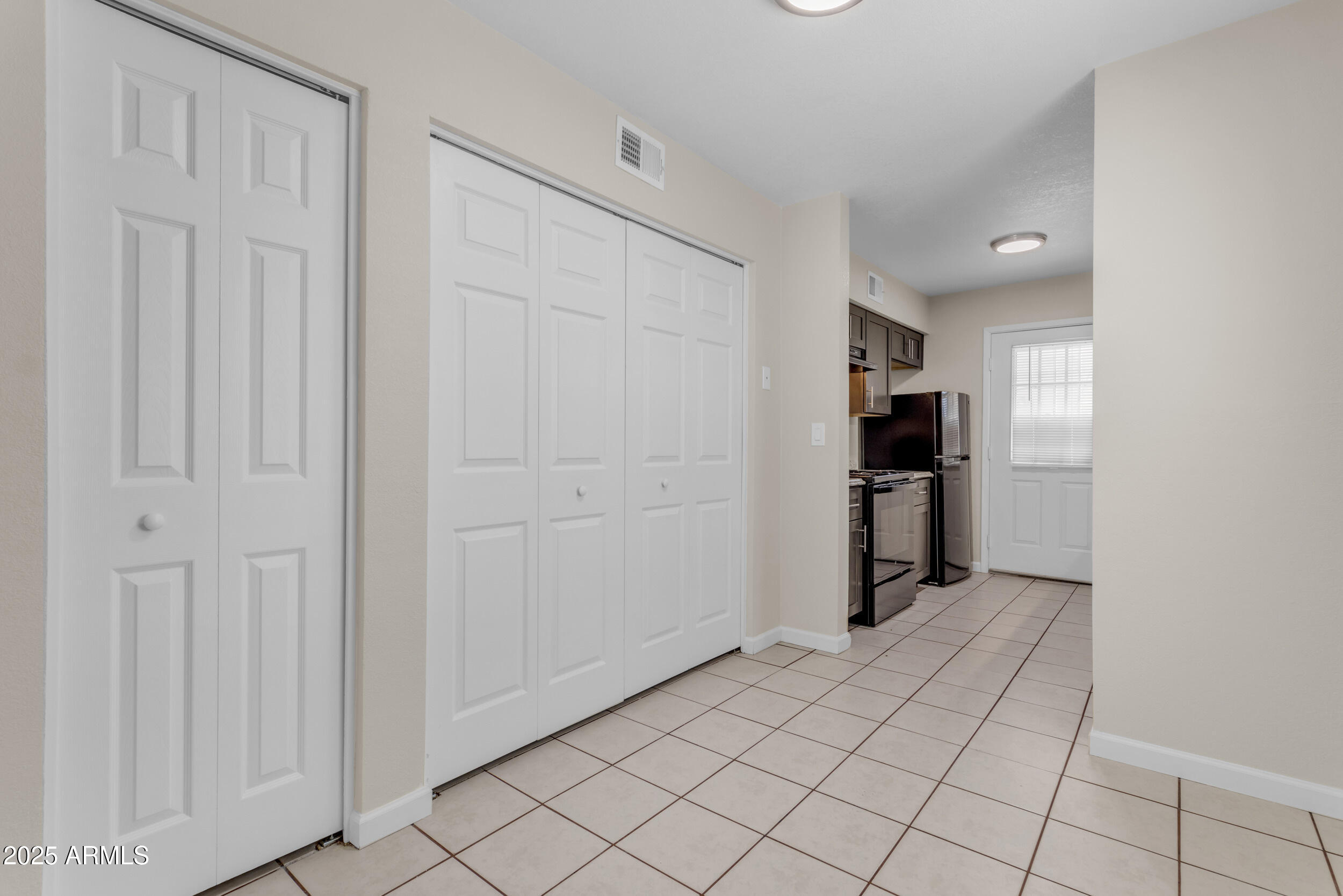 834 North Cherry, Unit 102 Mesa, AZ 85201 - Photo 9 of 24 a view of a kitchen with a refrigerator a sink dishwasher and refrigerator