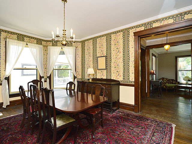 135 Akenside Road Riverside, IL 60546 - Photo 6 of 25 a view of a dining room with furniture window and wooden floor