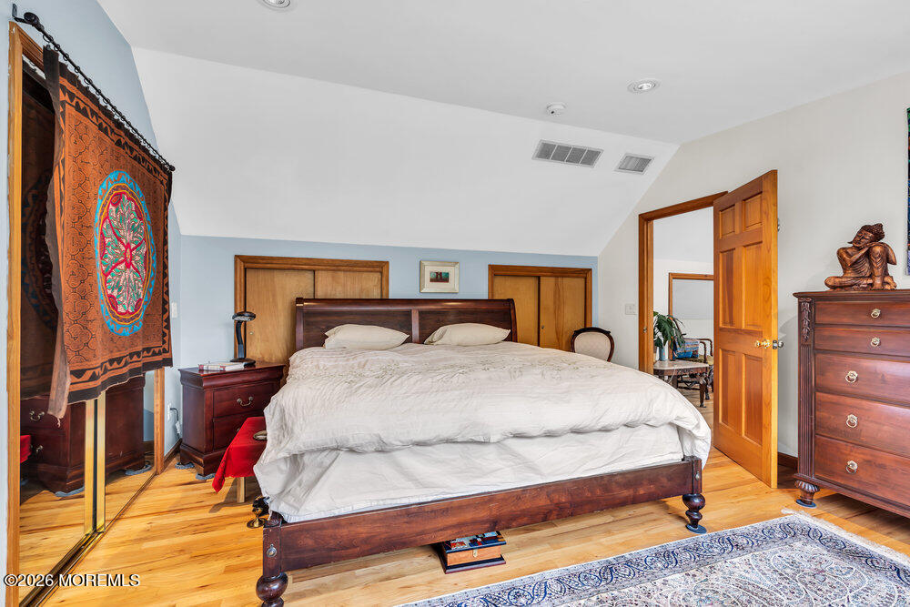 34 State Route Colts Neck, NJ 07722 - Photo 5 of 40 a bed sitting in a bedroom next to a window