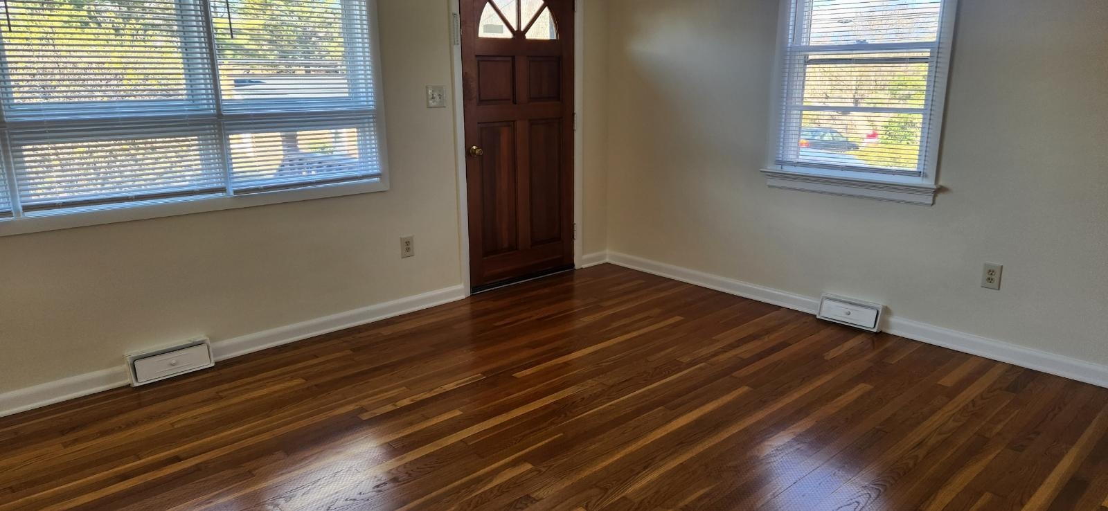 303 Old Greenville Road Staunton, VA 24401 - Photo 12 of 31 a view of an empty room with wooden floor and a window