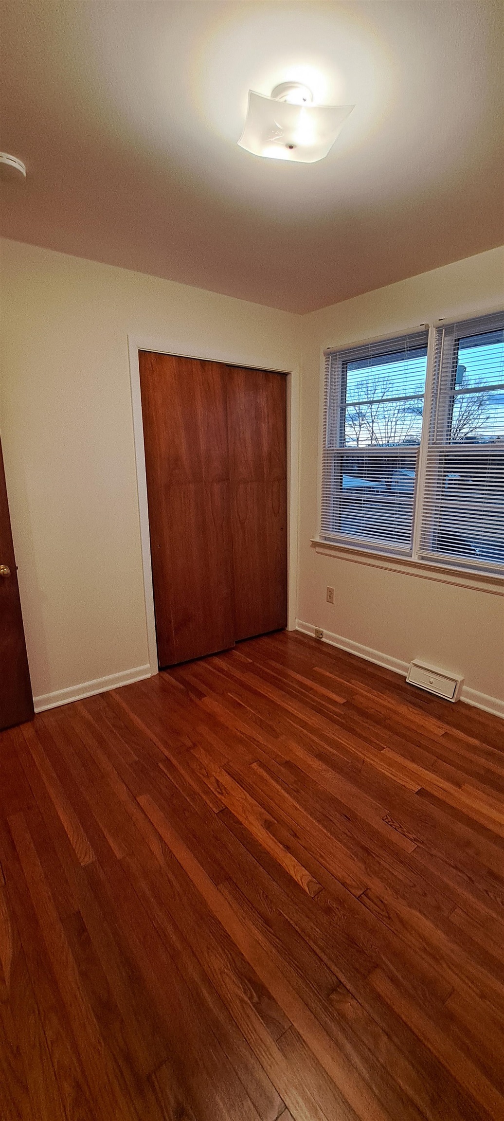 303 Old Greenville Road Staunton, VA 24401 - Photo 17 of 31 an empty room with wooden floor and windows
