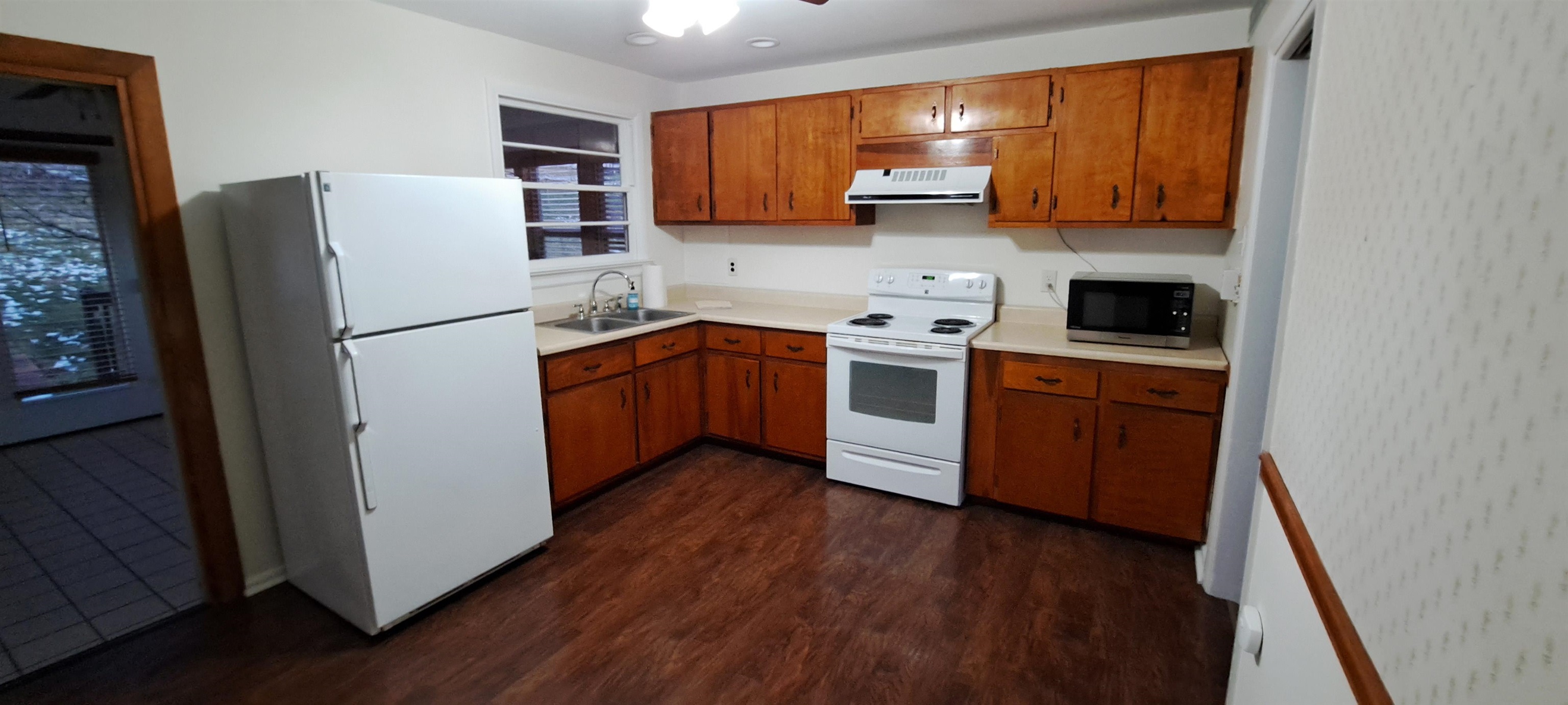 303 Old Greenville Road Staunton, VA 24401 - Photo 8 of 31 a kitchen with stainless steel appliances granite countertop a refrigerator stove a sink and dishwasher with wooden floor