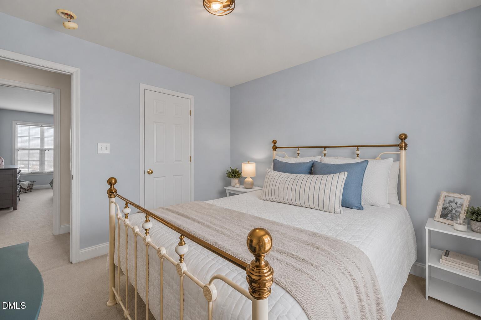 51 Water Front Lane Timberlake, NC 27583 - Photo 24 of 29 a bedroom with a bed and large windows