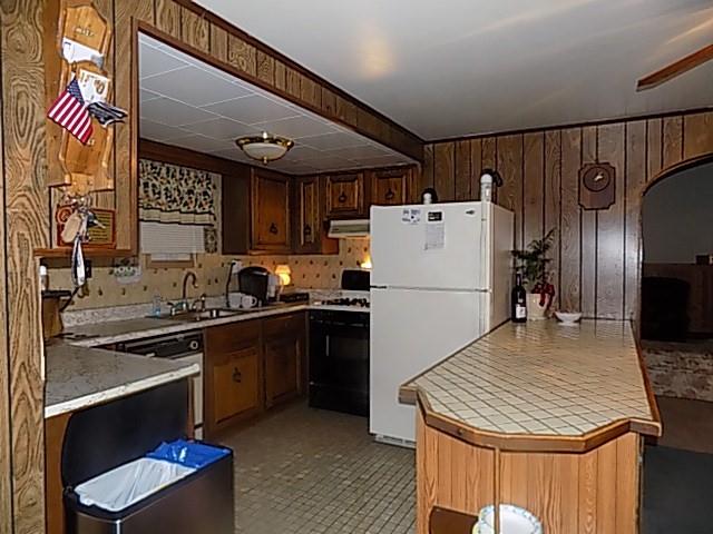 413 Lowell Street Vandergrift, PA 15690 - Photo 3 of 8 a kitchen with refrigerator and cabinets