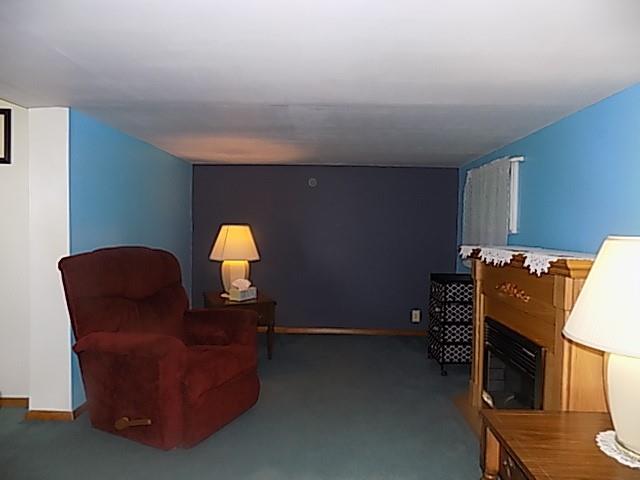 413 Lowell Street Vandergrift, PA 15690 - Photo 4 of 8 a room with furniture and a lamp