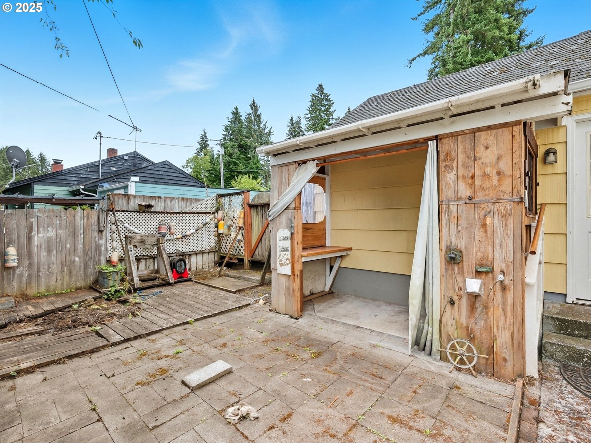 92965 Labeck Road Astoria, OR 97103 - Photo 17 of 31 a view of a patio with table and chairs a barbeque