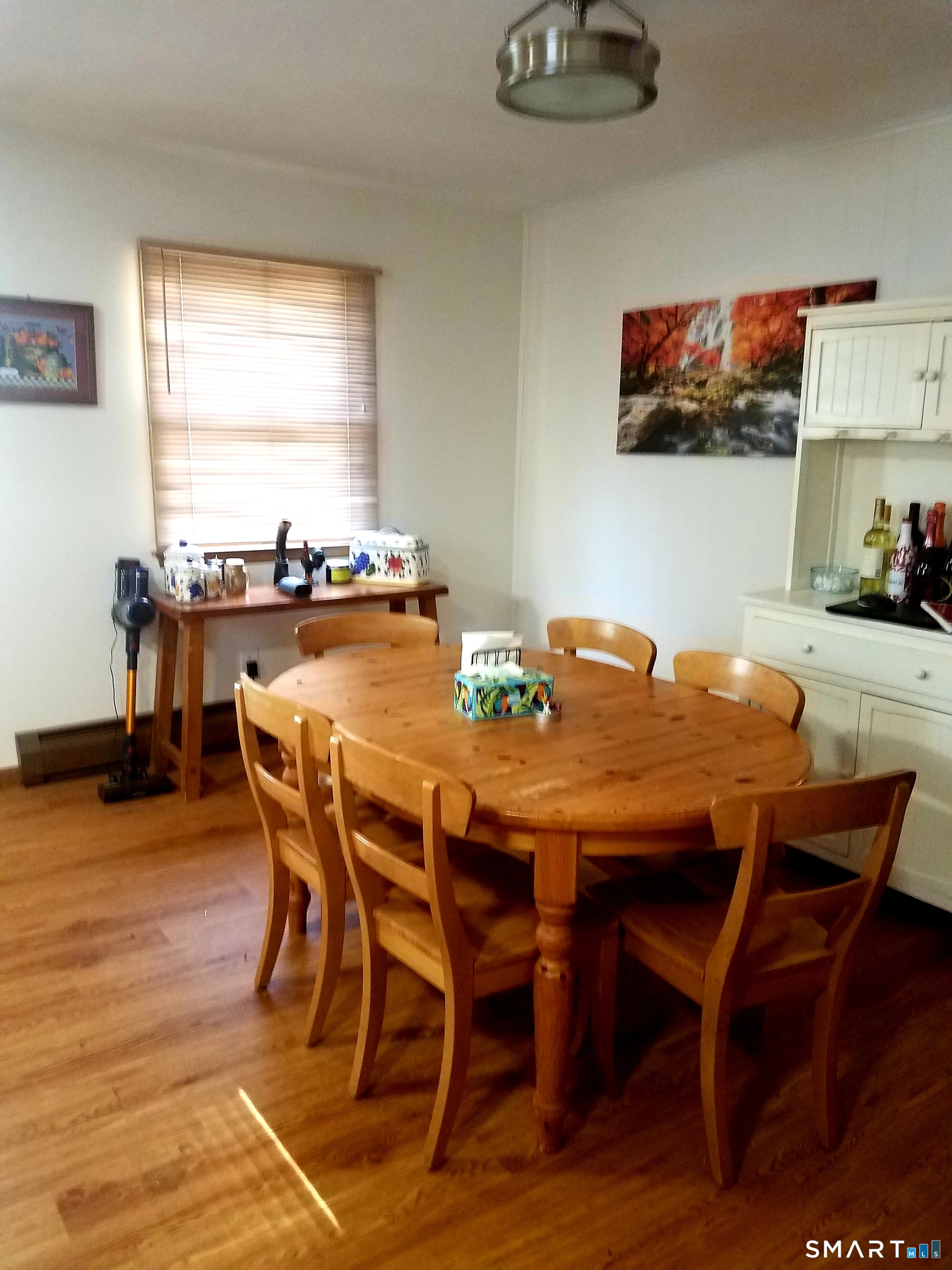 72 Maple Tree Avenue, Unit 2 Stamford, CT 06906 - Photo 6 of 25 a view of a dining room with furniture and wooden floor