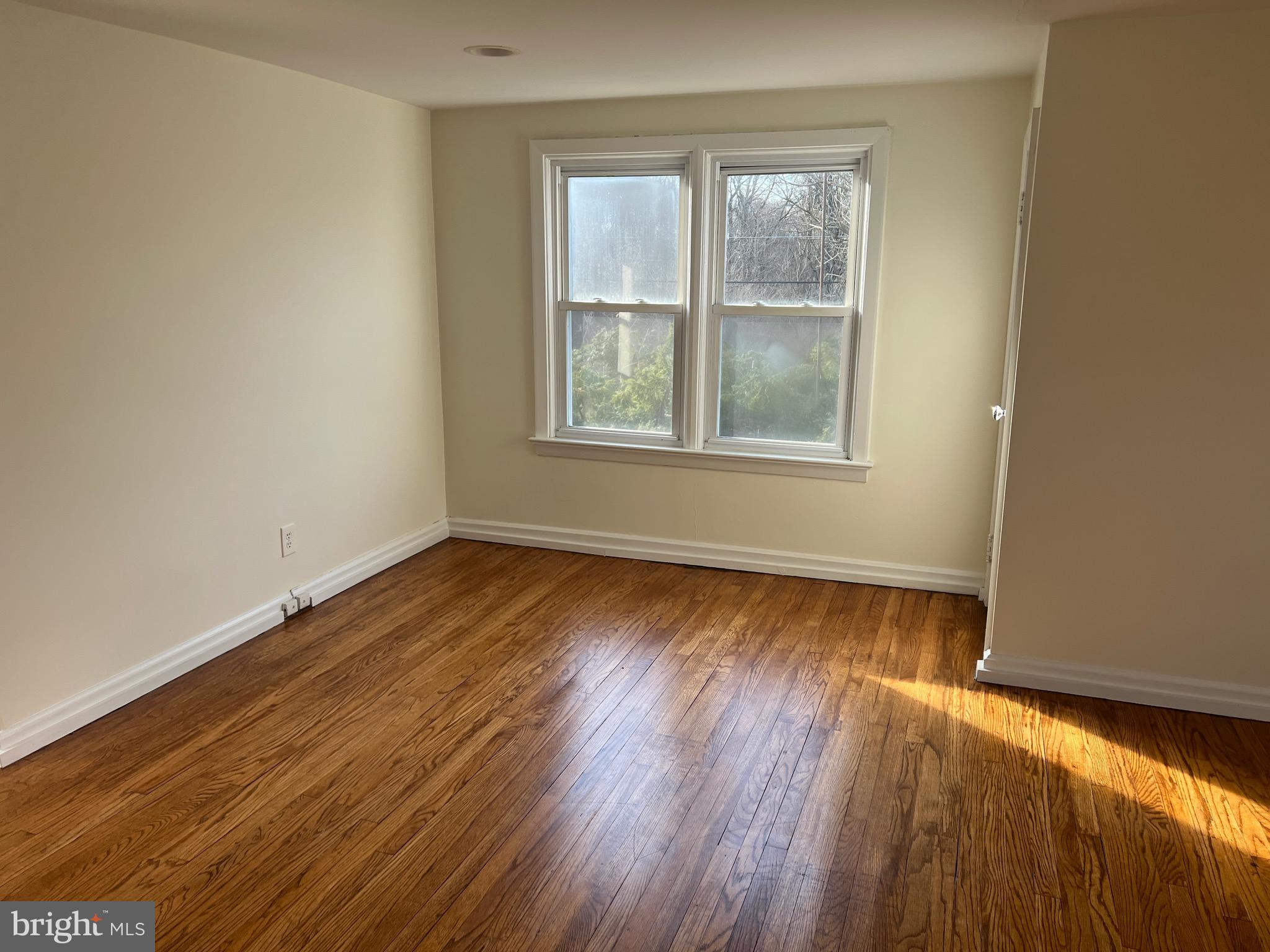 231 Highway 73 Hammonton, NJ 08037 - Photo 16 of 20 an empty room with wooden floor and windows