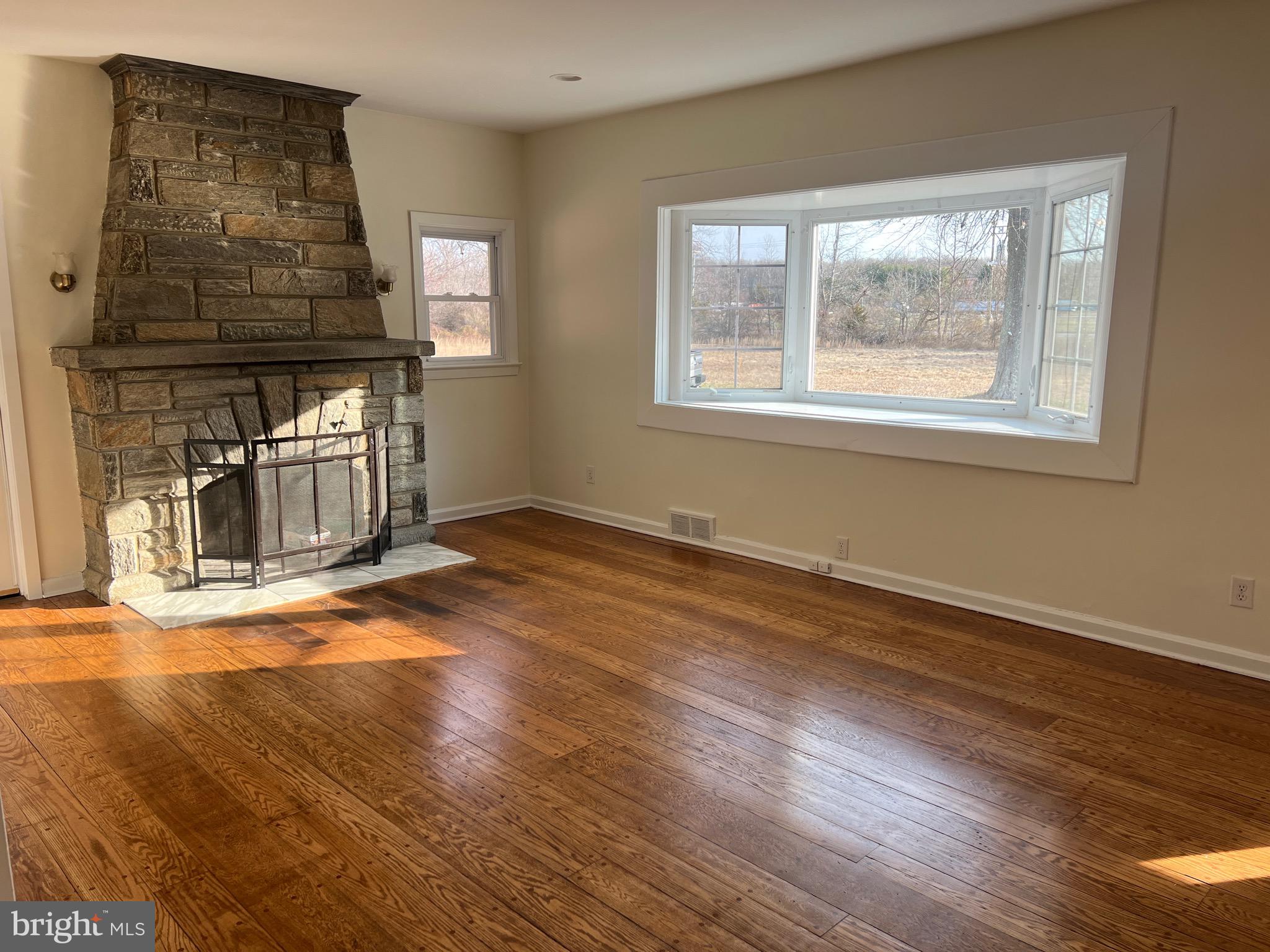 231 Highway 73 Hammonton, NJ 08037 - Photo 5 of 20 a view of empty room with wooden floor and fan
