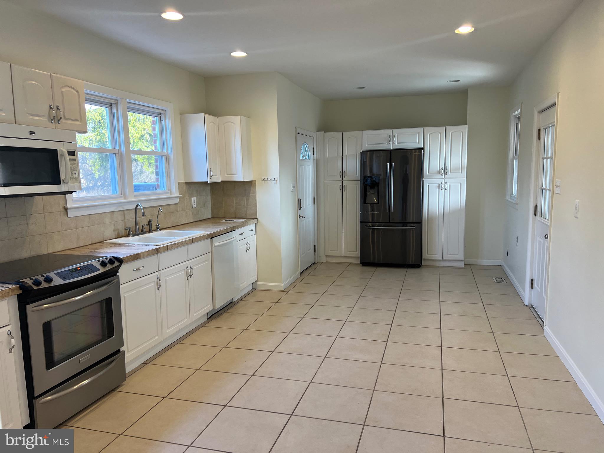 231 Highway 73 Hammonton, NJ 08037 - Photo 9 of 20 a kitchen with stainless steel appliances granite countertop a refrigerator and a stove top oven