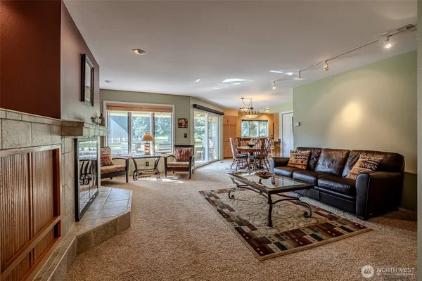 a living room with furniture and a large window