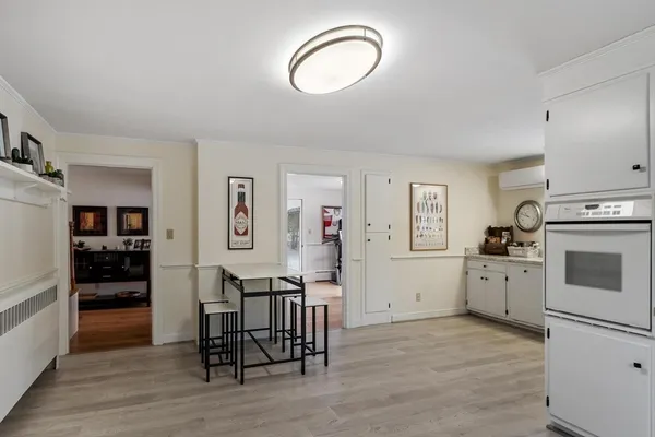 a view of kitchen with furniture and wooden floor