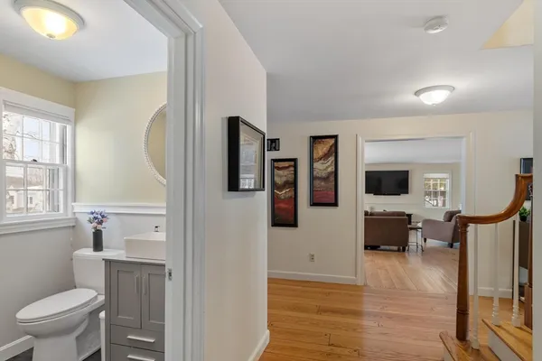 a bathroom with a toilet sink tub and mirror