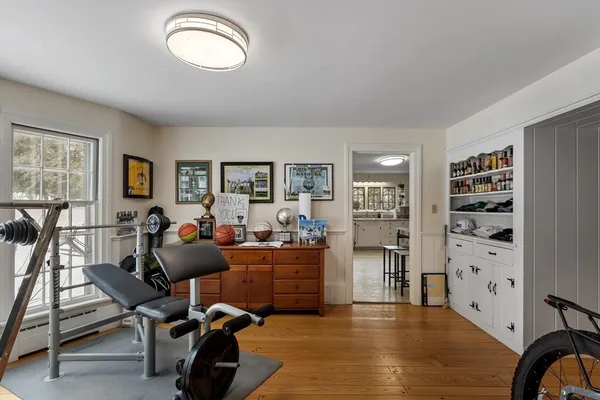 a view of a livingroom with workspace and a window