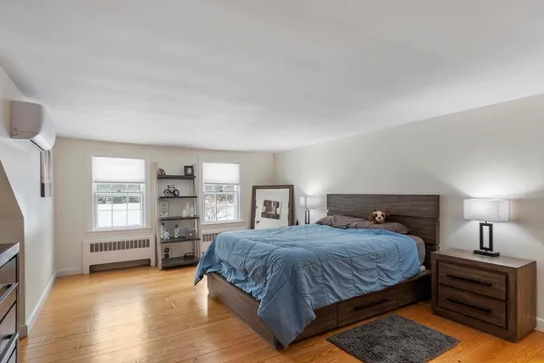 a bedroom with a bed and a cabinets