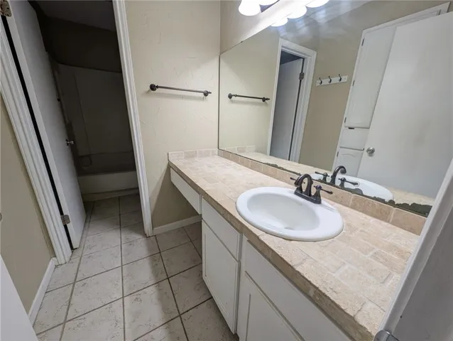 a white toilet sitting next to a bath tub