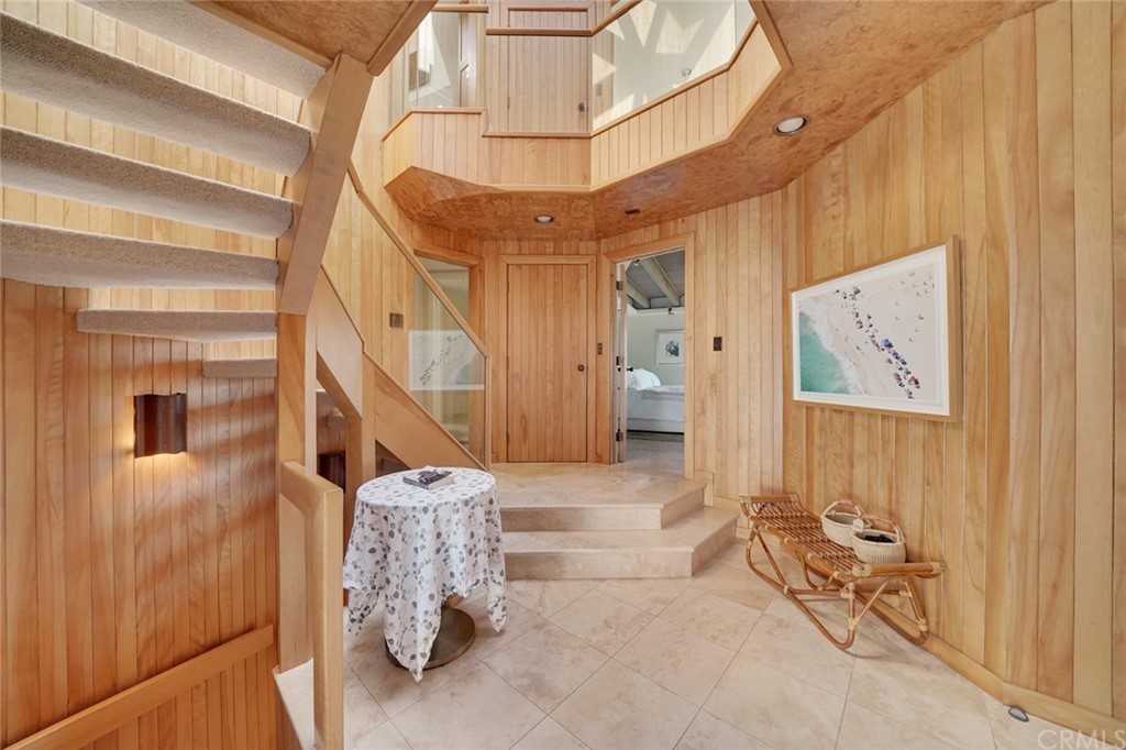 37 Emerald Bay Laguna Beach, CA 92651 - Photo 16 of 52 a living room with furniture and a chandelier