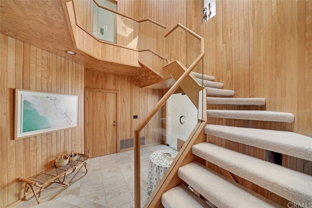 37 Emerald Bay Laguna Beach, CA 92651 - Photo 17 of 52 a view of staircase with white walls and a window
