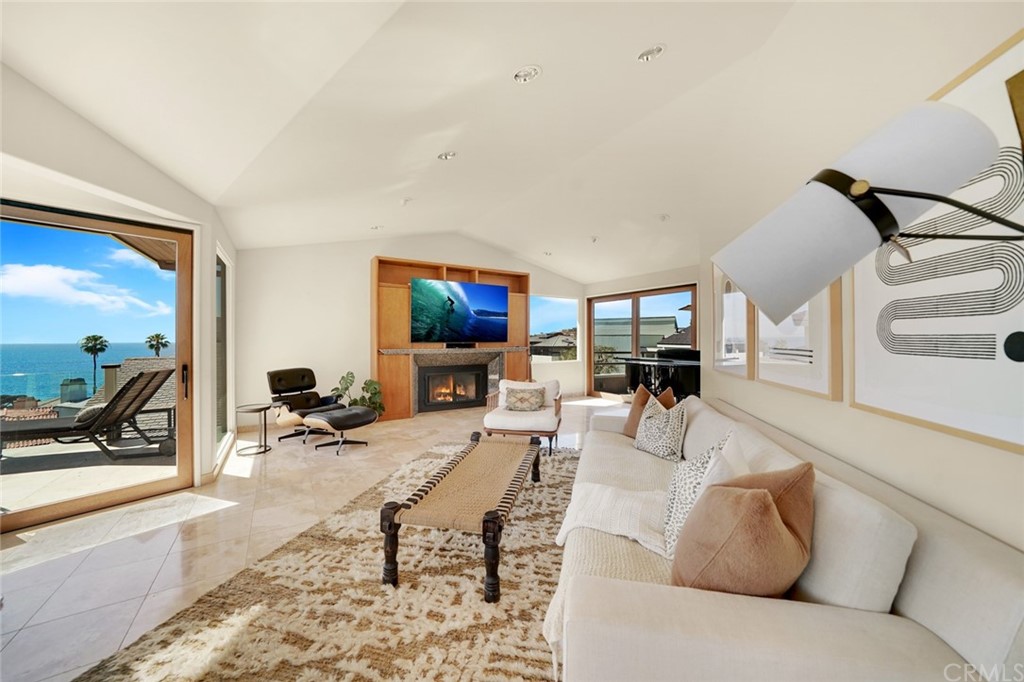 37 Emerald Bay Laguna Beach, CA 92651 - Photo 20 of 52 a living room with furniture and a flat screen tv