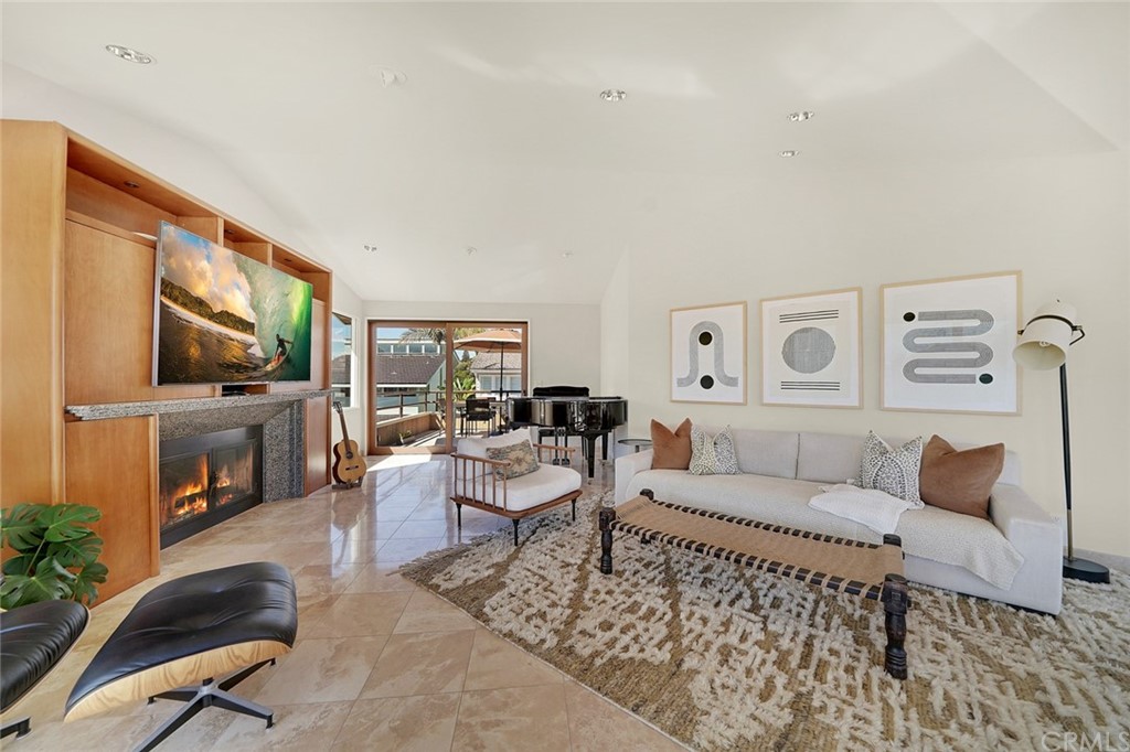 37 Emerald Bay Laguna Beach, CA 92651 - Photo 21 of 52 a living room with furniture a flat screen tv and a large window