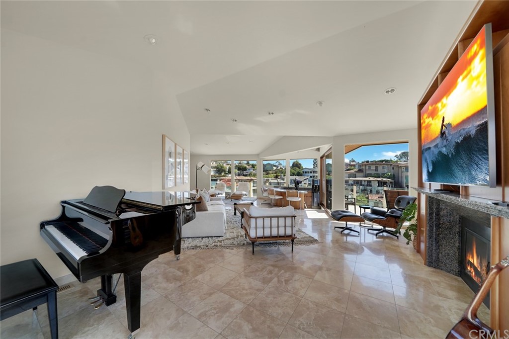 37 Emerald Bay Laguna Beach, CA 92651 - Photo 22 of 52 a living room with furniture and a fireplace