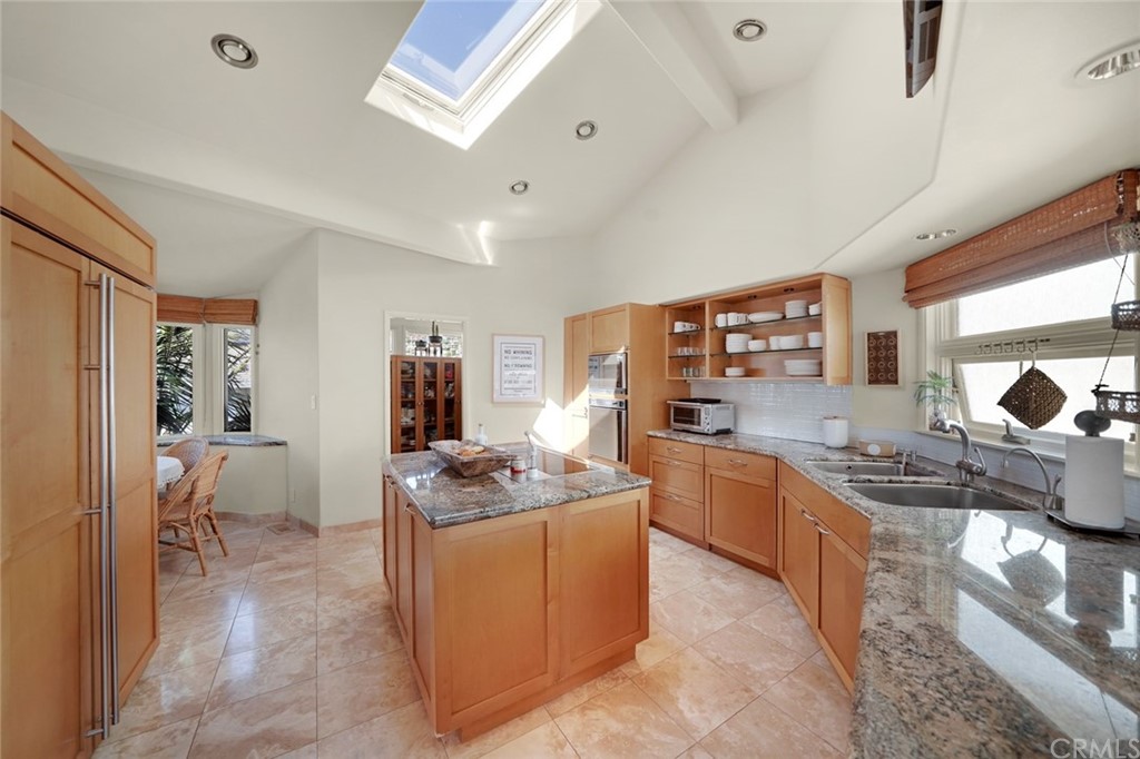 37 Emerald Bay Laguna Beach, CA 92651 - Photo 27 of 52 a kitchen with a stove a sink and a refrigerator