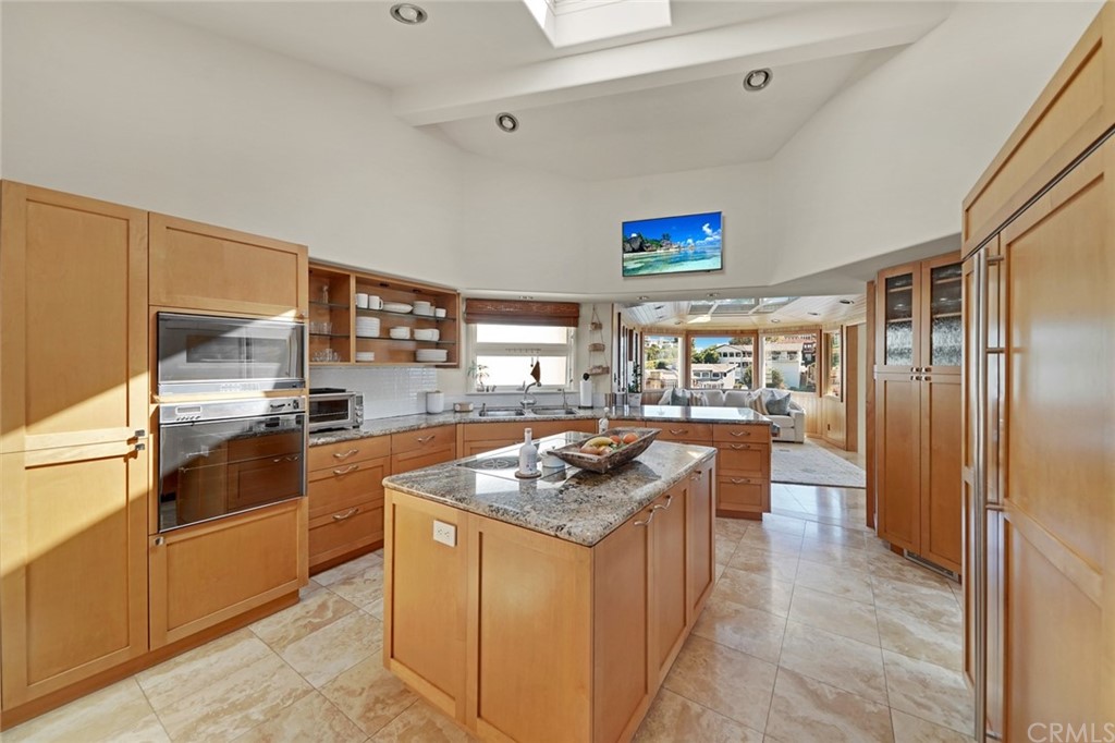 37 Emerald Bay Laguna Beach, CA 92651 - Photo 28 of 52 a kitchen with stainless steel appliances granite countertop a sink stove and refrigerator