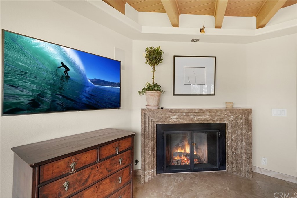 37 Emerald Bay Laguna Beach, CA 92651 - Photo 33 of 52 a living room with furniture and a fireplace