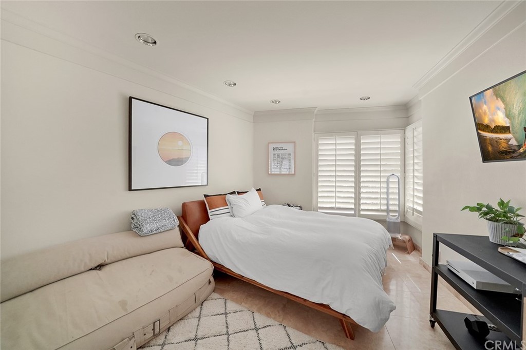 37 Emerald Bay Laguna Beach, CA 92651 - Photo 36 of 52 a bedroom with a bed and a flat screen tv