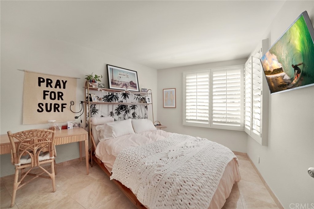 37 Emerald Bay Laguna Beach, CA 92651 - Photo 37 of 52 a bedroom with a bed and a flat screen tv